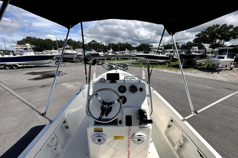 Slide: The Image of 2022 Key West 1720 Center Console boat interior with steering wheel and controls. - 16