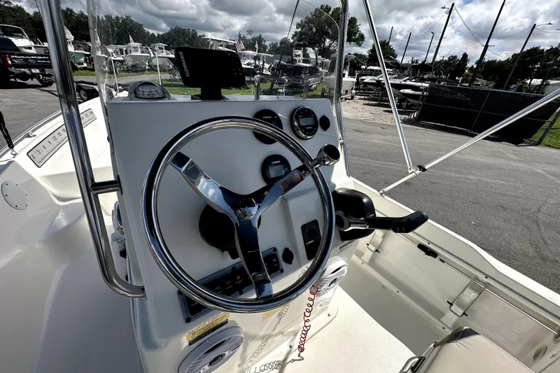 Slide: The Image of 2022 Key West 1720 Center Console boat interior with steering wheel and controls. - 18