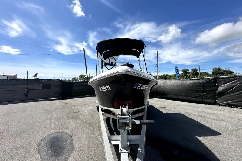 Slide: The Image of 2022 Key West 1720 Center Console boat with Yamaha engine on trailer. - 2