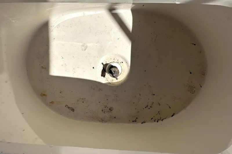 Slide: The Image of Dirty boat compartment in 2022 Key West 1720 Center Console. - 23