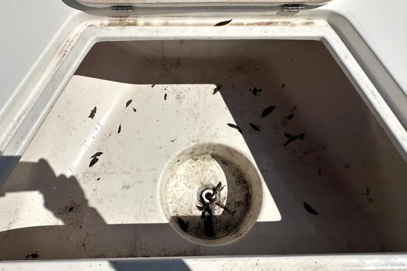 Slide: The Image of Dirty storage compartment in 2022 Key West 1720 Center Console boat. - 27