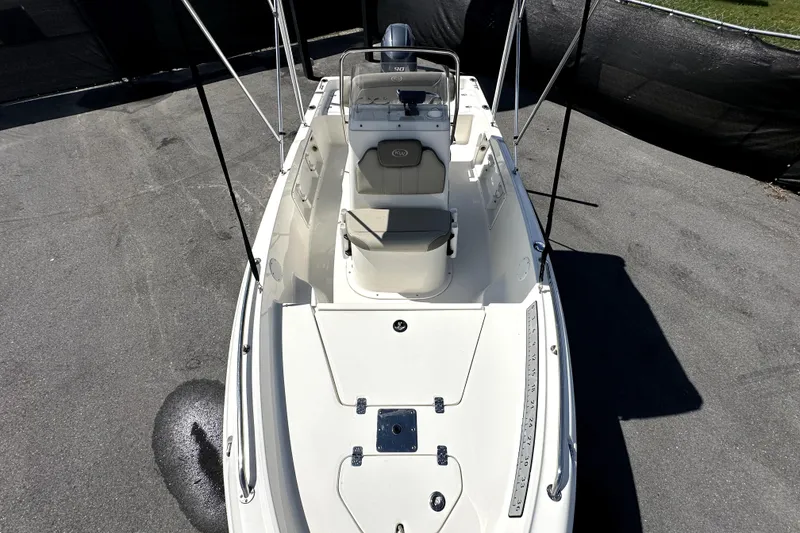 Slide: The Image of 2022 Key West 1720 Center Console boat, top view, parked on pavement. - 30