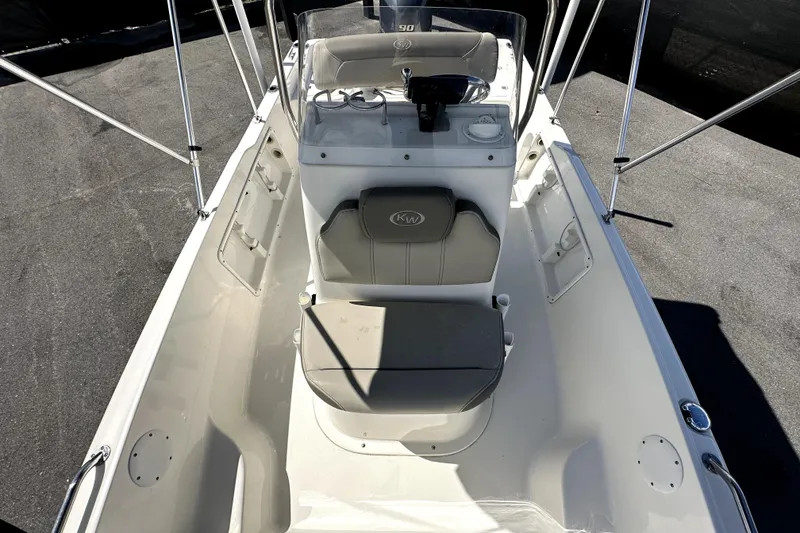 Slide: The Image of 2022 Key West 1720 Center Console boat interior with seating and steering console. - 32