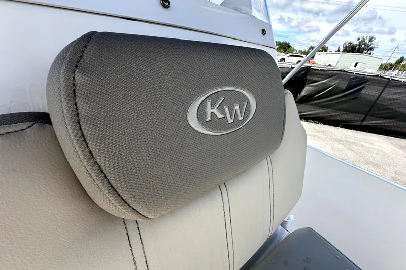 Slide: The Image of 2022 Key West 1720 Center Console boat seat with KW logo, outdoor setting. - 33