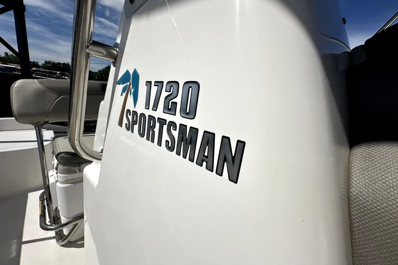 Slide: The Image of 2022 Key West 1720 Center Console boat with "Sportsman" logo detail. - 34