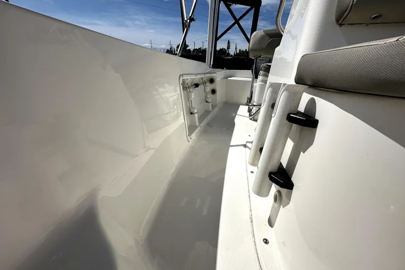 Slide: The Image of 2022 Key West 1720 Center Console boat interior with rod holders and seating. - 35