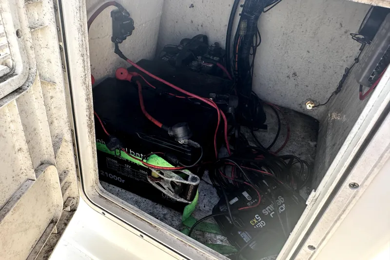 Slide: The Image of Battery compartment of a 2022 Key West 1720 Center Console boat with wiring. - 38