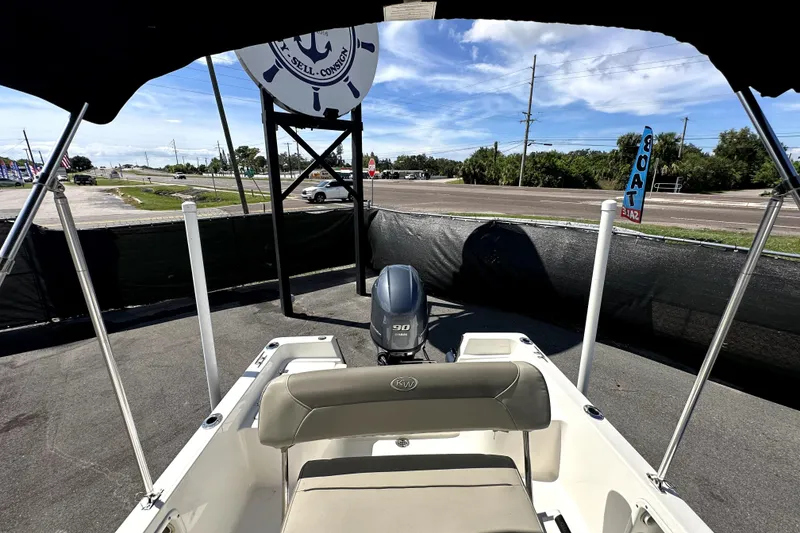 Slide: The Image of 2022 Key West 1720 Center Console boat with Yamaha engine, displayed outdoors. - 39