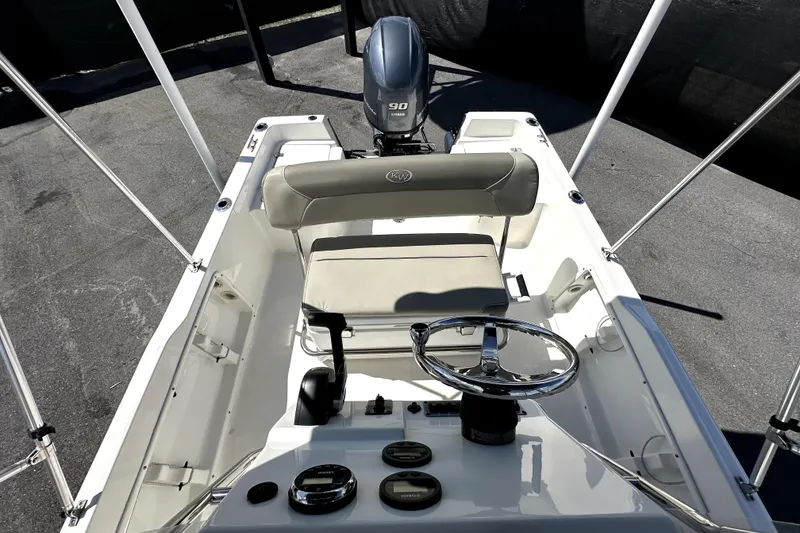 Slide: The Image of 2022 Key West 1720 Center Console boat interior with steering wheel and seating. - 40