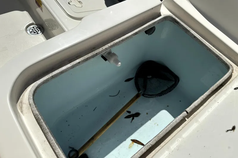 Slide: The Image of Livewell on 2022 Key West 1720 Center Console boat with net and debris. - 45