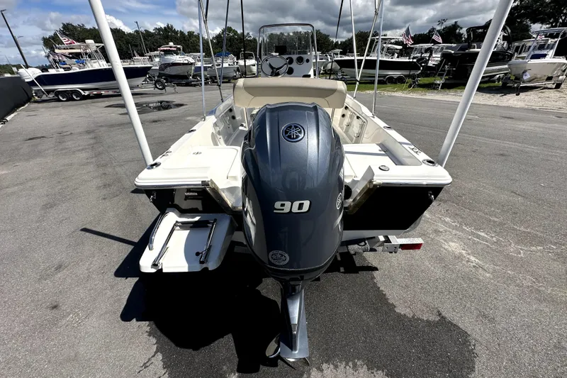 Slide: The Image of 2022 Key West 1720 Center Console with Yamaha outboard motor in a sunny outdoor setting. - 7