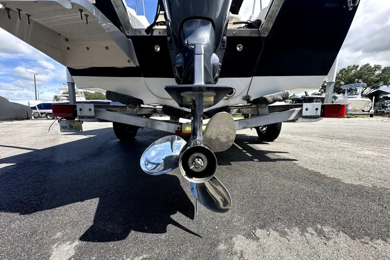 Slide: The Image of 2022 Key West 1720 Center Console boat on trailer under blue sky. - 9