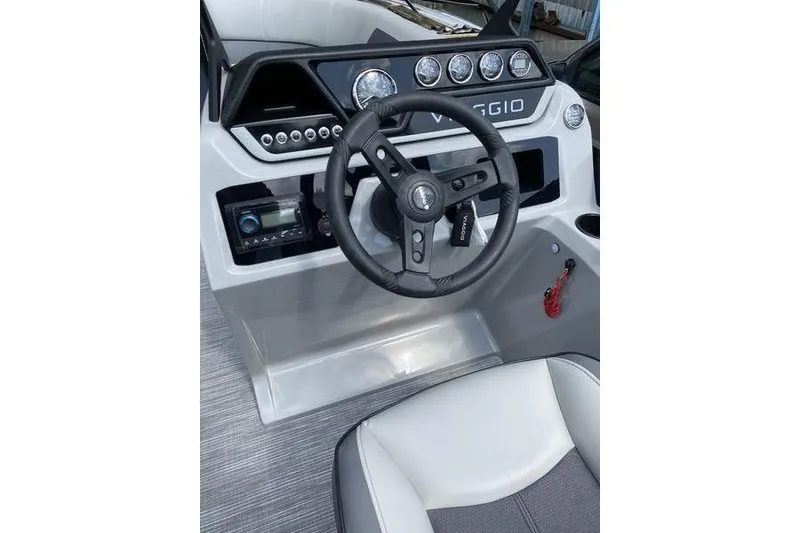 Slide: The Image of 2025 Viaggio Lago V-U boat dashboard with steering wheel and control panel. - 11