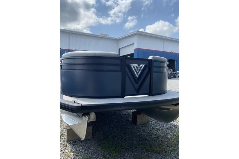 Slide: The Image of 2025 Viaggio Lago V-U pontoon boat at a marina under a cloudy sky. - 2