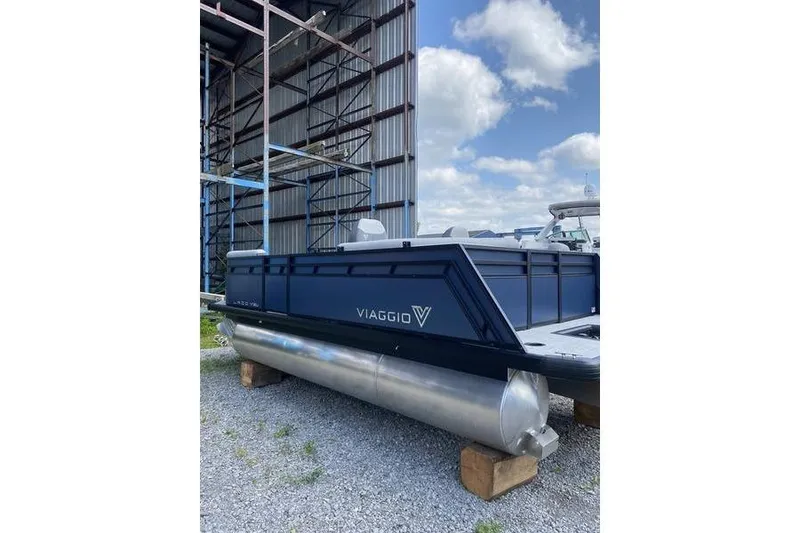Slide: The Image of 2025 Viaggio Lago V-U pontoon boat in storage, featuring sleek design and modern build. - 5
