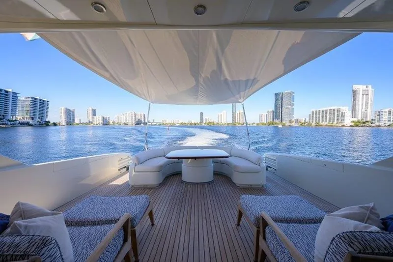 Slide: The Image of Luxurious 2005 McMullen & Wing Custom Express Sport Cruiser on scenic waterfront. - 2