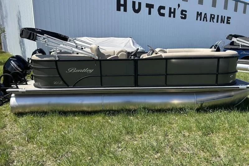 The Image of 2024 Bentley Pontoons LE 200 CW at Hutch's Marine, side view on grass. - 1