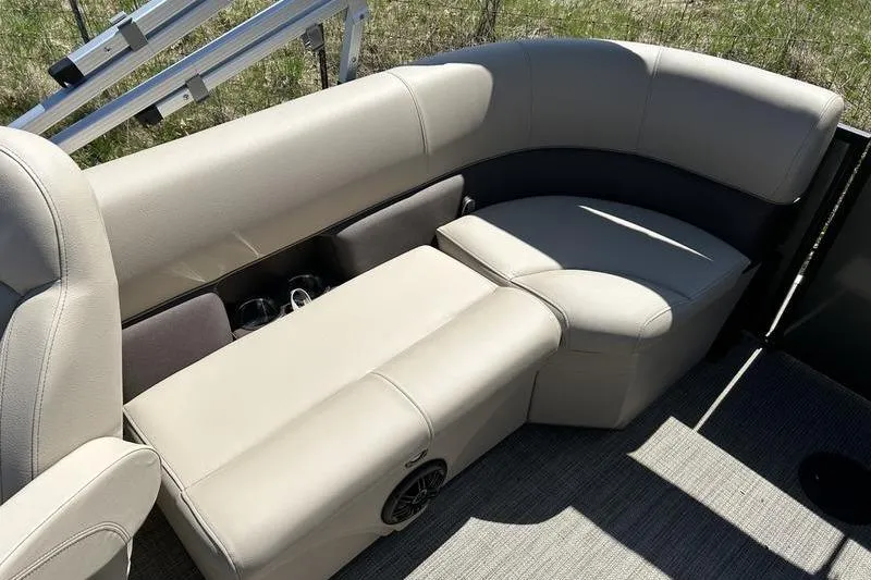 Slide: The Image of 2024 Bentley Pontoons LE 200 CW interior seating with beige upholstery and cup holders. - 13