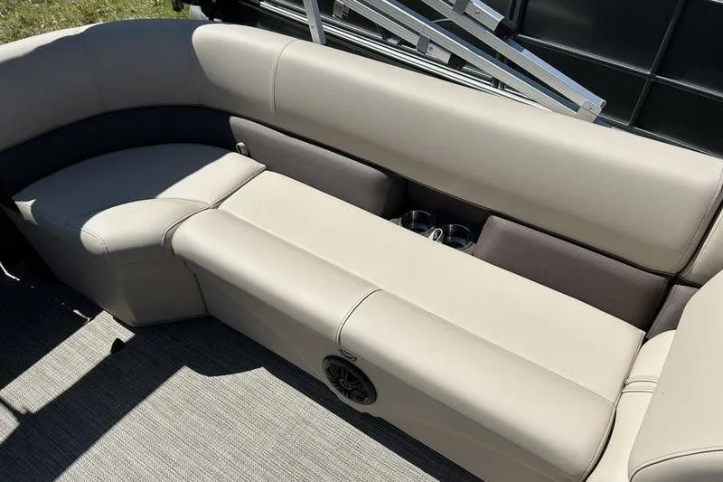 Slide: The Image of 2024 Bentley Pontoons LE 200 CW interior seating with cup holders and speaker. - 15