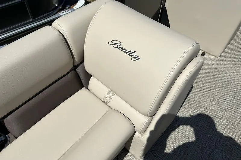 Slide: The Image of 2024 Bentley Pontoons LE 200 CW beige seating with embroidered logo. - 20