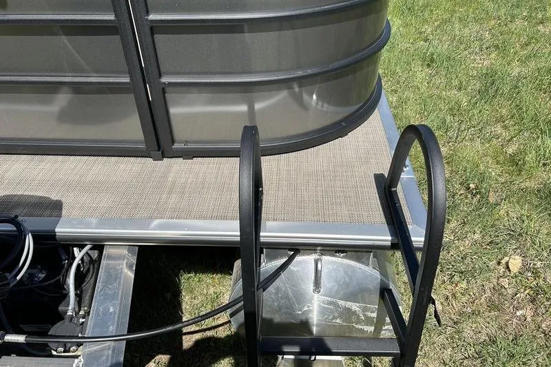 Slide: The Image of 2024 Bentley Pontoons LE 200 CW, rear view with ladder and deck details. - 8