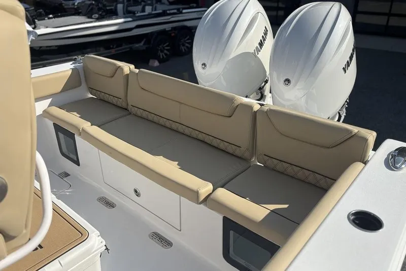 Slide: The Image of 2026 Sportsman Heritage 261 Center Console with beige seating and dual Yamaha engines. - 10