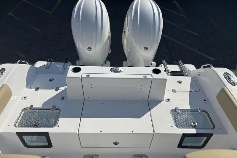 Slide: The Image of 2026 Sportsman Heritage 261 Center Console boat with dual engines and fishing amenities. - 12