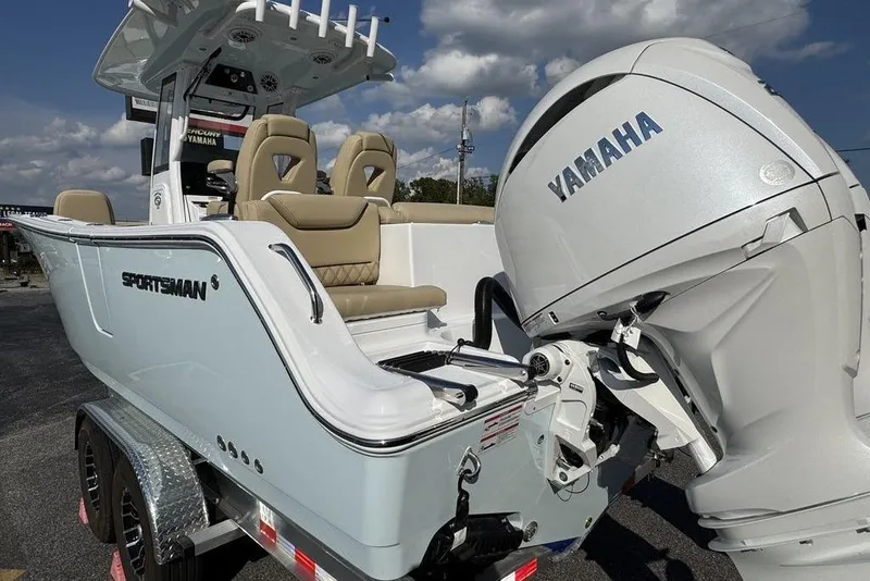 Slide: The Image of 2026 Sportsman Heritage 261 Center Console boat with Yamaha engine, parked on a trailer. - 15