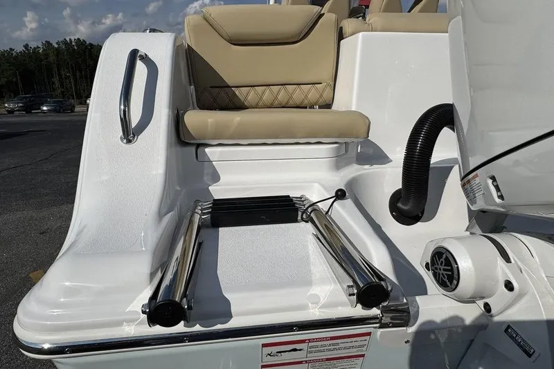 Slide: The Image of 2026 Sportsman Heritage 261 Center Console boat with seating and ladder detail. - 18
