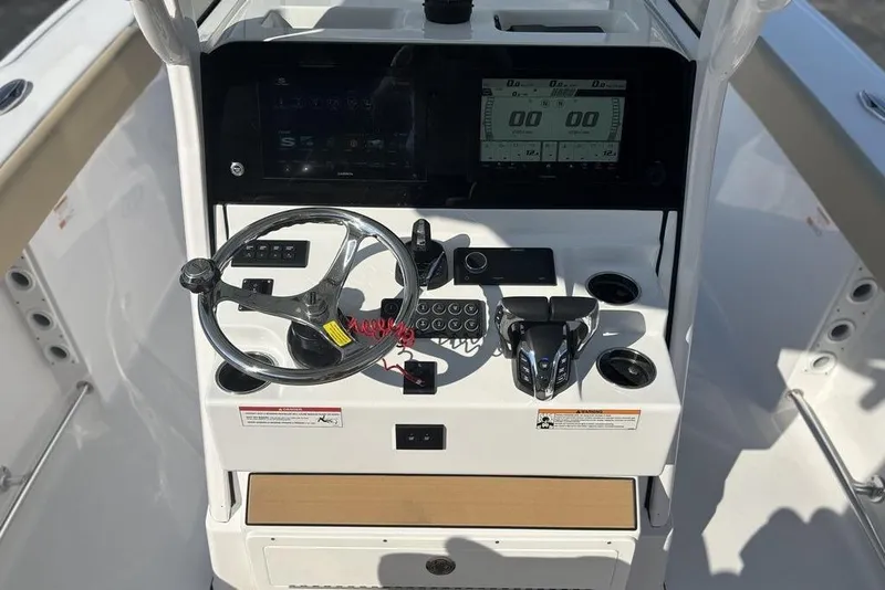 Slide: The Image of 2026 Sportsman Heritage 261 Center Console dashboard with steering wheel and controls. - 20