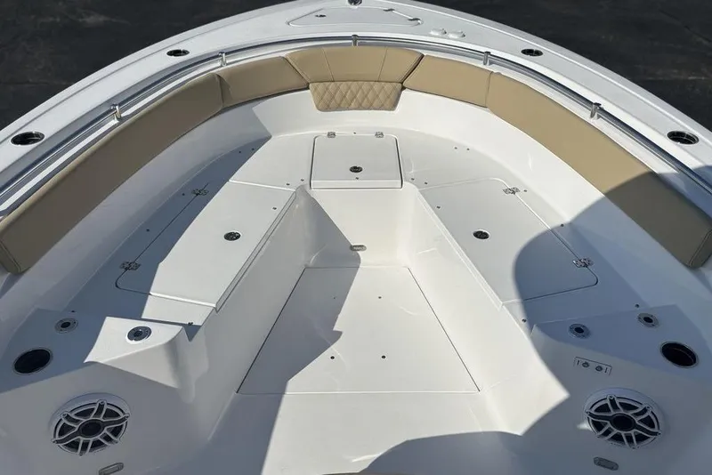 Slide: The Image of 2026 Sportsman Heritage 261 Center Console boat interior with cushioned seating and storage compartments. - 27