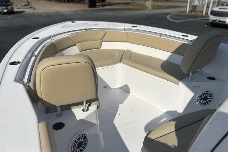 Slide: The Image of 2026 Sportsman Heritage 261 Center Console boat with beige seating and modern design. - 29