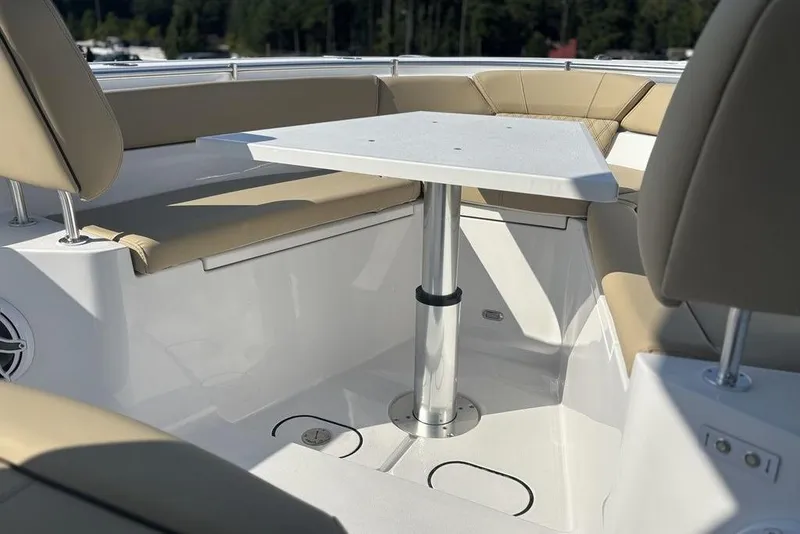 Slide: The Image of 2026 Sportsman Heritage 261 Center Console interior with seating and table. - 30