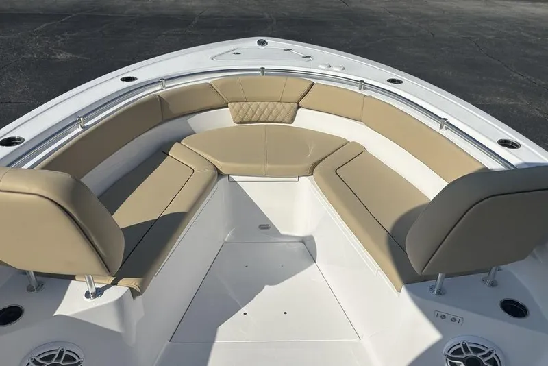 Slide: The Image of 2026 Sportsman Heritage 261 Center Console boat with tan cushioned seating. - 32