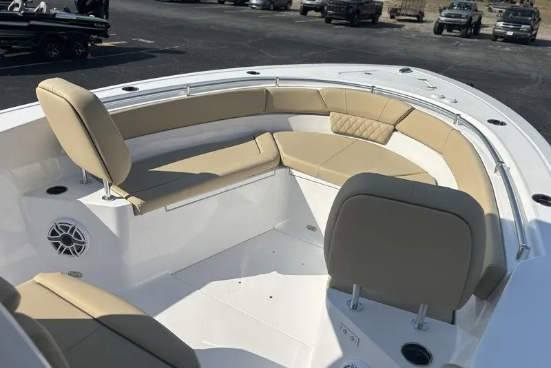 Slide: The Image of 2026 Sportsman Heritage 261 Center Console boat with beige seating and modern design. - 33