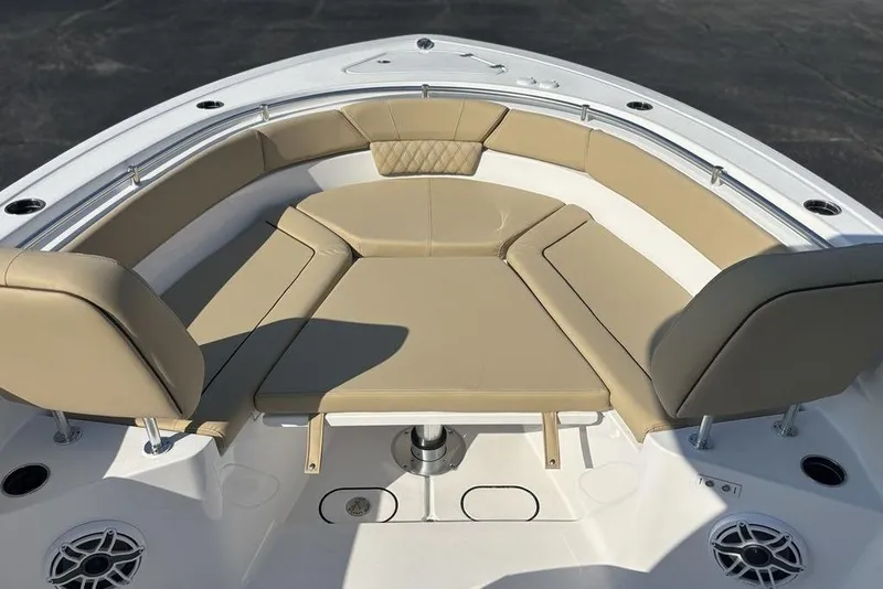Slide: The Image of 2026 Sportsman Heritage 261 Center Console boat with tan cushioned seating area. - 34