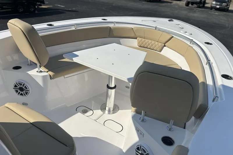 Slide: The Image of 2026 Sportsman Heritage 261 Center Console boat interior with seating and table. - 35