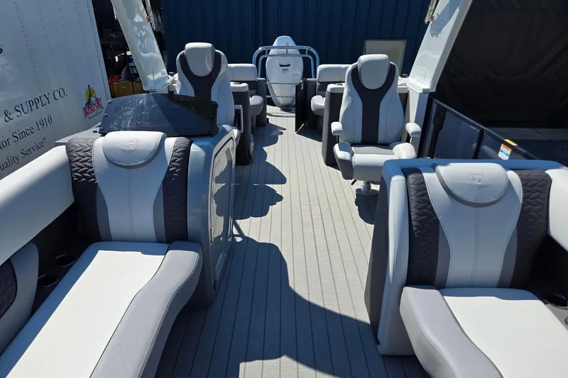 Slide: The Image of 2025 Godfrey Monaco 255 SB boat interior with luxurious seating and modern design. - 12