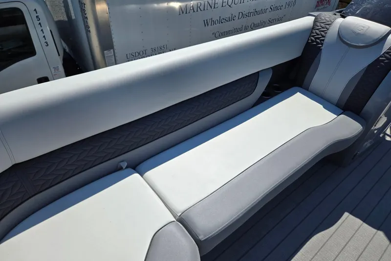 Slide: The Image of Luxurious seating on 2025 Godfrey Monaco 255 SB pontoon boat, featuring elegant upholstery design. - 13