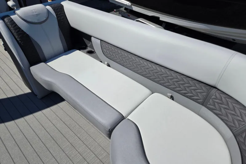 Slide: The Image of Luxurious seating on 2025 Godfrey Monaco 255 SB boat, featuring elegant design and comfortable upholstery. - 14