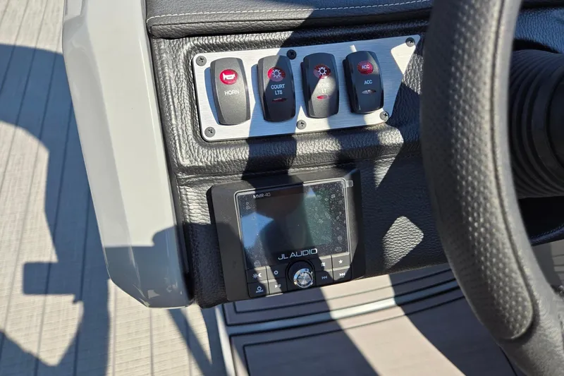Slide: The Image of Control panel of 2025 Godfrey Monaco 255 SB boat with JL Audio system. - 19
