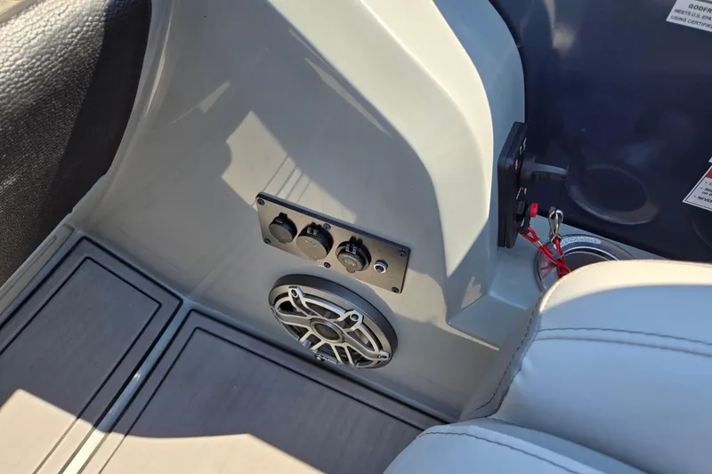 Slide: The Image of Control panel and speaker on 2025 Godfrey Monaco 255 SB boat interior. - 21