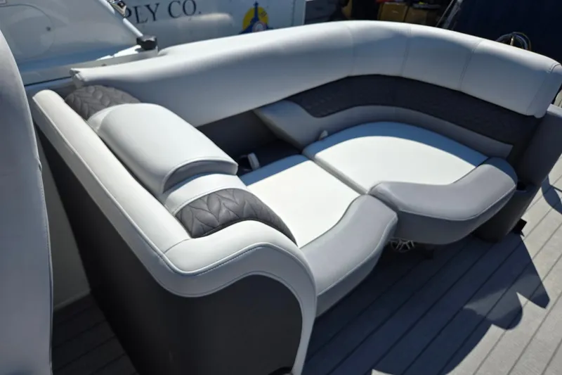 Slide: The Image of Luxurious seating on 2025 Godfrey Monaco 255 SB boat, featuring elegant gray upholstery. - 24