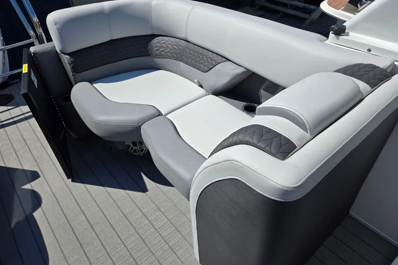 Slide: The Image of Luxurious seating on 2025 Godfrey Monaco 255 SB boat, featuring elegant gray upholstery. - 25