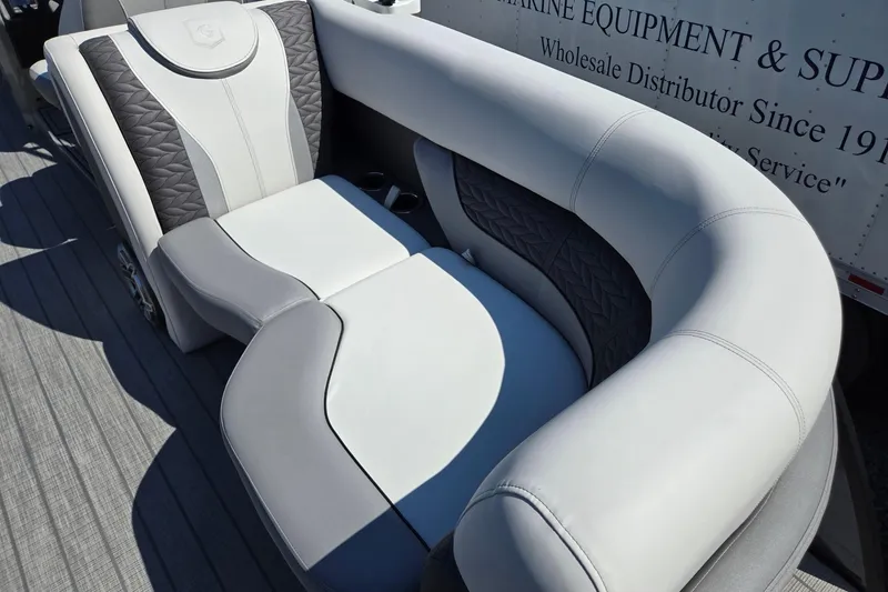 Slide: The Image of Luxurious seating on 2025 Godfrey Monaco 255 SB boat, featuring elegant gray and white upholstery. - 31