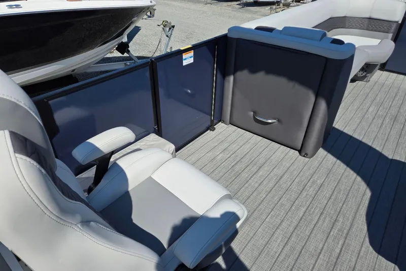 Slide: The Image of 2025 Godfrey Monaco 255 SB boat interior with seating and flooring details. - 33