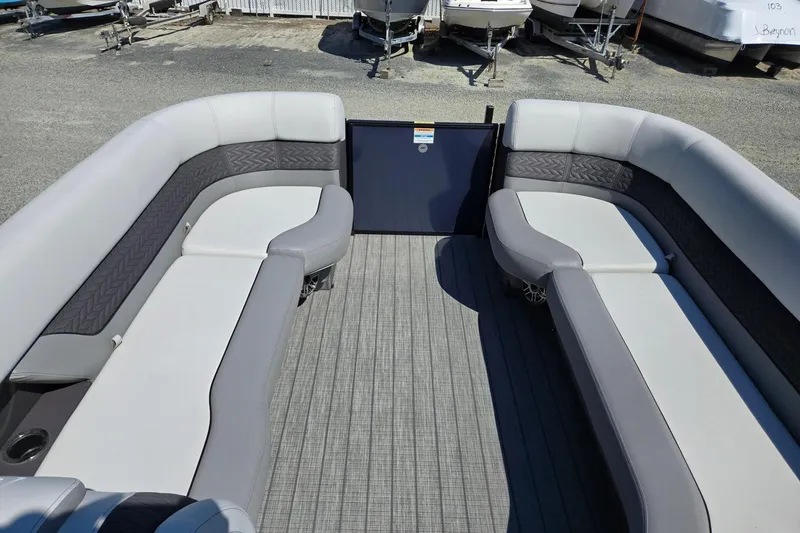 Slide: The Image of 2025 Godfrey Monaco 255 SB pontoon boat interior with gray seating and flooring. - 38