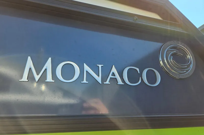 Slide: The Image of 2025 Godfrey Monaco 255 SB logo with coastal edition emblem. - 41