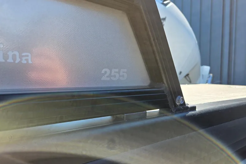 Slide: The Image of Close-up of 2025 Godfrey Monaco 255 SB boat detail with sunlight reflection. - 42