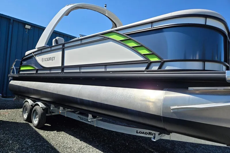 Slide: The Image of 2025 Godfrey Monaco 255 SB pontoon boat on trailer, featuring sleek design and modern accents. - 9